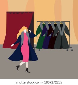 Young woman in a fur coat store trying on a coat.