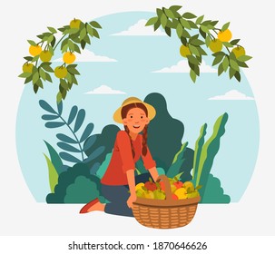 Young woman in a garden with a basket full of fresh apples