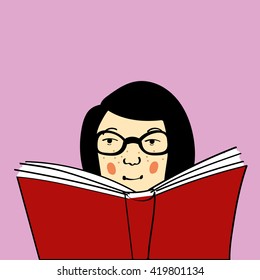 Young woman or girl with freckles and glasses being a bookworm and reading a big red book. Copy space provided.