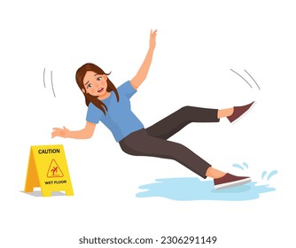 Young woman having accident slipping on wet floor and falling down near yellow caution sign