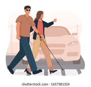 Young woman helping blind man crossing the road