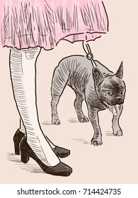 A young woman with her pet on a walk