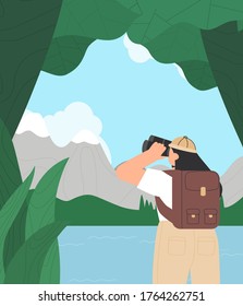 Young woman in hiking clothes, looking through binoculars, on green nature background. Blue sky, lake, travel. Concept of discovery, exploration, hiking, adventure tourism and travel.
