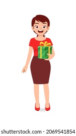 young woman holding box present in christmas