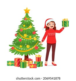 young woman holding box present in christmas