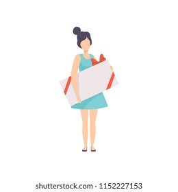Young woman holding large gift box decorated with red ribbon bow, people celebrating holidays concept vector Illustration on a white background