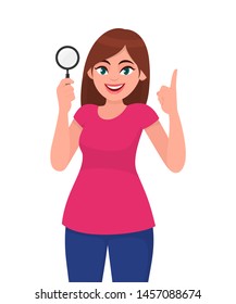 Young woman holding magnifying glass. Girl pointing up index finger. Female character design illustration. Human emotions, facial expressions, feelings concept illustration in vector cartoon style.