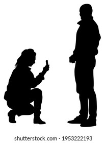 Young woman holds a smartphone in her hand. Isolated silhouettes of people on a white background