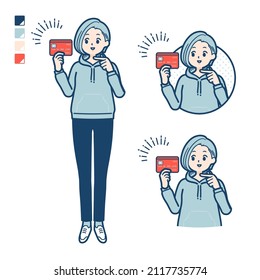 A Young woman in a hoodie with pointing at credit card images.It's vector art so it's easy to edit.