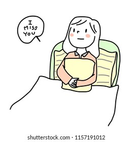 Young woman hugging pillow on her bed. Unhappy teenage girl hugging pillow with arms crossed. "I miss you" card with woman lying on bed under comforter, hug pillow, look away and think about someone.