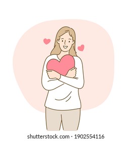 Young woman hugs big