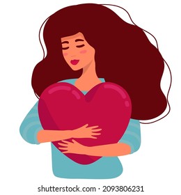 Young woman hugs a big heart with love and care. Girl with long hair holds pink heart in her hands.. suitable for St. Valetin