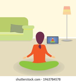 Young woman indoors sitting on the floor and meditating in lotus position, looking at tv