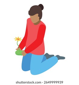Young woman is kneeling and carefully holding a flower pot with a yellow flower