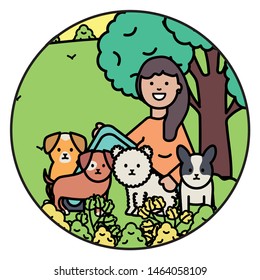 young woman with little dogs in the park