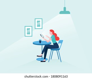 Young woman looking at her smartphone in cafe