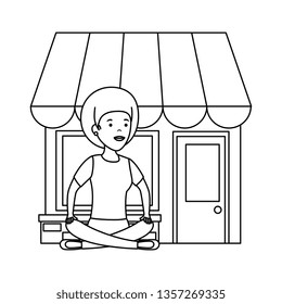young woman in lotus position with store building
