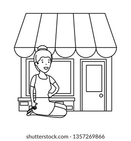 young woman in lotus position with store building