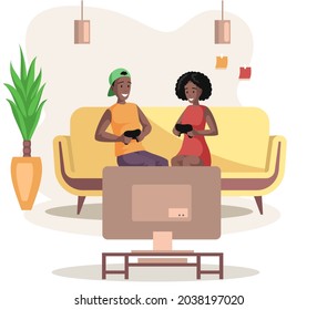 Young woman and man with gamepads playing videogame on sofa. Couple with joysticks in hands playing with console. People spend time with technology at home. Home leisure activity for friends