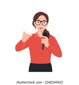 Young woman mc with microphone talking and pointing to the audience. Flat vector illustration isolated on white background