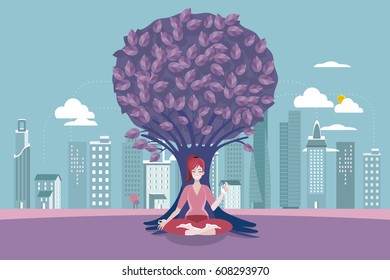 Young woman meditating with crossed legs in front of a tree.  