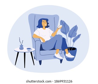 A young woman with a mobile phone in her arm is sitting in an armchair between a potted plant and a journal table with a mug and a small vase. Flat design, modern style. Monochrome colours