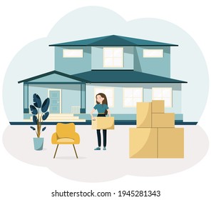 A young woman moves into a new house. Boxes of things, Furniture.