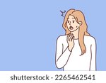 Young woman opens mouth when she sees unexpected event or experiences shock reaction after harsh statement. Girl is shocked by unexpected news about moving crisis or upcoming problems in labor market 