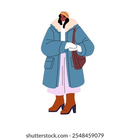 Mujer joven en ropa exterior camina al aire libre. Chica en abrigo de parka, sombrero de punto, mitones, botas altas con bolso de hombro de pie. Persona con ropa de abrigo en invierno. Ilustración vectorial aislada plana en blanco