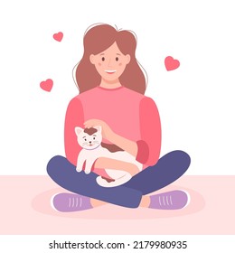 Young woman and pet, flat style. Happy girl holding a cat in her arms. Cute vector illustration.