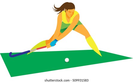 Young woman player in field hockey hit the free-kick