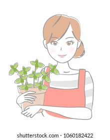 Young woman with potted plants