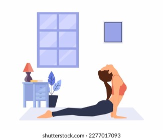 Young woman practicing cobra pose at home, yoga pose, workout fitness, aerobic and exercises.