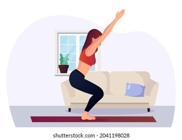 Young Woman Practicing Yoga Chair Pose At Home