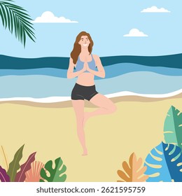 A young woman practicing yoga in tree pose by the sea on a tropical beach.