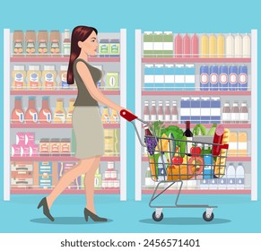 Young woman pushing supermarket shopping cart full of groceries. Vector illustration in flat style