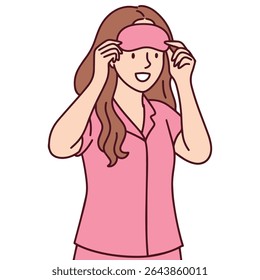 Jovem coloca máscara adormecida antes de dormir enquanto está de pijama e se prepara para o descanso noturno