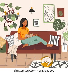 Young woman reading a book. Beautiful girl in home interior with plants, relaxing concepts of home and comfort. Girl daily lifestyle, everyday routine scene. Hobby, book lover, indoor concept.