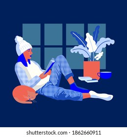Young woman reading a book. Relaxing at home