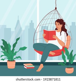Young woman reads a book in a hanging chair in a room with a large window. Home relaxation concept. Cozy apartment with indoor plants. Flat vector illustration.
