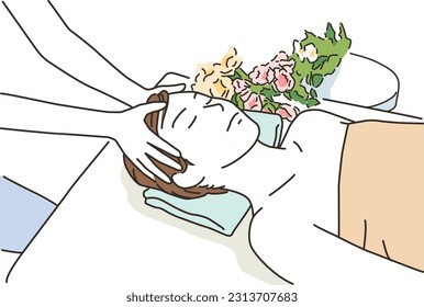 Young woman receiving treatment on a massage bed
