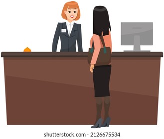 Young woman receptionist stands at reception desk. Travel, hospitality, booking concept. Hotel employee greets lady visitor. Staff services guest at reception. Girl checking into hotel room