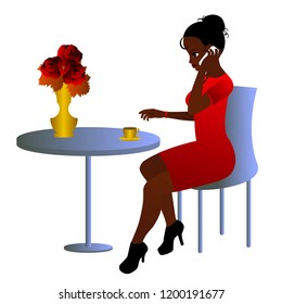 Young woman in red dress sitting at the table in a cafe and talking on the phone