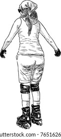 Young woman rides on the roller skates