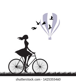 Young Woman Riding Bike With Birds And Hot Air Balloon In Behind