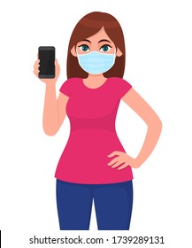 Young woman in safety medical mask showing blank phone. Girl holding mobile, cellphone or smartphone. Female character illustration. Modern digital technology lifestyle. Corona virus epidemic outbreak
