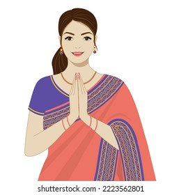 Young woman in a saree greeting namaste