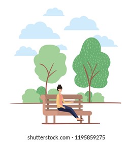 young woman seated in chair on the park