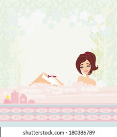 Young woman shaving her legs in bath. 
