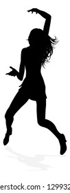 A young woman in silhouette dancing like at a night club or other event
